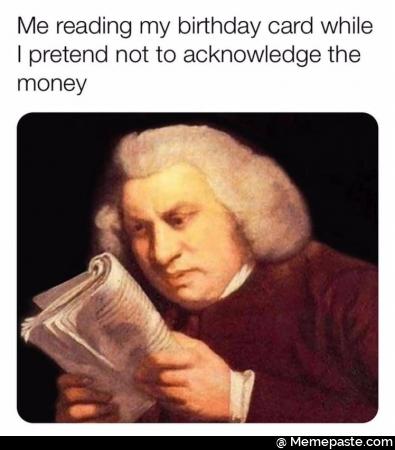 Me reading my birthday card while I pretend not to acknowledge the money